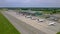 Ryanair, Wizz Air and Enter Air airplanes parked in front of modern airport terminal in Wroclaw. Establishing shot from drone