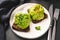 Rye avocado sandwich with chopped parsley