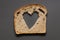 Rye bread bread slice with heart shaped hole