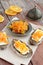 Rye bread with butter and homemade orange confiture on rusted wooden table