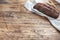 Rye bread with cereals, a fresh loaf of grain baguette on a wooden background. copy space