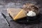 Rye bread, crispbread, cheese, curd cheese in a plate on the kitchen table