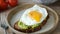 Rye bread toast with mashed avocado and sunny side up egg