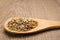 Rye cereal grain. Grains in wooden spoon. Rustic.