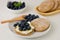 Rye flatbread with ricotta, honey and blueberries