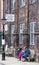 RYE, UK / 1st of JUNE 2014 - Two unknown women are sitting on a bench in front of the Grammar School Records shop