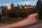 S-bend of a highway illuminated by street lamps at dusk