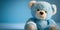 It\\\'s a Boy! - Light blue cuddly teddy bear on baby blue background. Adorable baby shower stuffed animal. Newborn child.