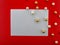 It`s holiday time! Festive blank white greeting card on a red background.