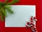 It`s holiday time! Festive blank white greeting card on a red background.