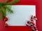 It`s holiday time! Festive blank white greeting card on a red background.