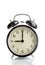 It`s nine o`clock already, time to wake up for breakfast, vintage old black metallic alarm clock