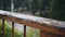 It\'s raining outside. close-up of the balcony handrails.