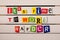 It\'s time to work harder motivational quote written with color magazine letter clippings on wooden board. Concept image