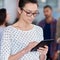 She\'s in touch with latest news. Cropped closeup of a young woman working on her digital tablet in the office.