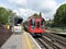 S8 Stock London Underground train leaving Chorleywood Station on the Metropolitan Line railway