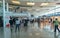 Sa Carneiro airport interior view, departures and arrivals,inside shopping stores and people walking with suitcases and bags,