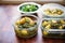 saag aloo meal prep in multiple containers
