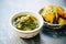 saag aloo paired with mango chutney in a small bowl