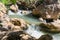 The Saar  mountain river with cold and crystal clear water flows in a crevice in the mountains of the Golan Heights in Israel