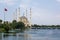 Sabanci Merkez Cami Central Mosque on the Seyhan River in cloudy weather in Turkey