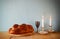 Sabbath image. challah bread and candelas on wooden table