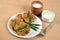 Sabudana vada with fried green chili, Sago cutlet and chutney and butter milk