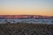 Sacramento Mountains Glow Bright Orange At Sunset Over White Sands