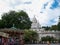 Sacre Coeur Basilica in summer day. A lot of tourists sitting on the stairs. Large medieval cathedral. August 05, 2009, Paris,