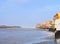 Sacred Gomti River meeting the Ocean, Indian Traditional Ghats and Hindu Temple at Distance - Devbhoomi Dwarka, Gujarat, India