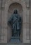 The `Sacred Heart` bronze statue of Jesus in a niche on the front of the Cathedral Basilica of Saints Peter and Paul, Philadelphia