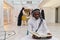 In the sacred month of Ramadan, an African American Muslim man engrossed in reading the Holy Quran is surrounded by a