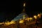 Sacred pagoda flanking with ritual candles,incense,lotus