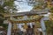 Sacred rope, or shimenawa, and streamers, or shide, on torii gate to small local shinto shrine, Kanazawa, Japan