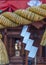 Sacred rope, or shimenawa, and zigzag streamer, or shide, on red vermillion torii gate to local shinto shrine, Kanazawa,