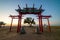 The sacred tree in Kalmykia. Silhouette of a gate or arch at the entrance to the cult object