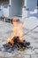 Sacrificial offering burnt in front of ancestor tombstone