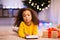 Sad african little girl with unwanted Christmas gift cellphone