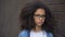 Sad african teenager eyeglasses leaning wall, problem hopelessness, insecurities