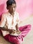 Sad alone teenagers pupils being served Meal plate of rice In government School Canteen. Unhealthy food for poor children