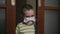 Sad boy in medical mask, looking at camera despleased . Virus protection, pandemic, prevention epidemic.