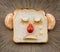 Sad bread face on ceramic plate