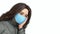 Sad brunette young woman in medical face mask 3D