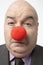 Sad Businessman Wearing Clown Nose