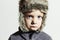 Sad child in fur Hat.Kids casual winter style.little boy.children emotion
