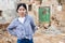 Sad chinese woman and destroyed house after earthquake