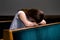 A Sad Christian girl in white shirt is sitting and praying with humble heart in the church