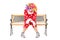 Sad clown sitting on a wooden bench