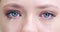 Sad, cry and closeup of blue eyes of woman for depression, vision and mental health. Tears, iris and retina with