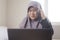 Sad Crying Muslim Businesswoman to See Bad Financial Loss Report on Laptop